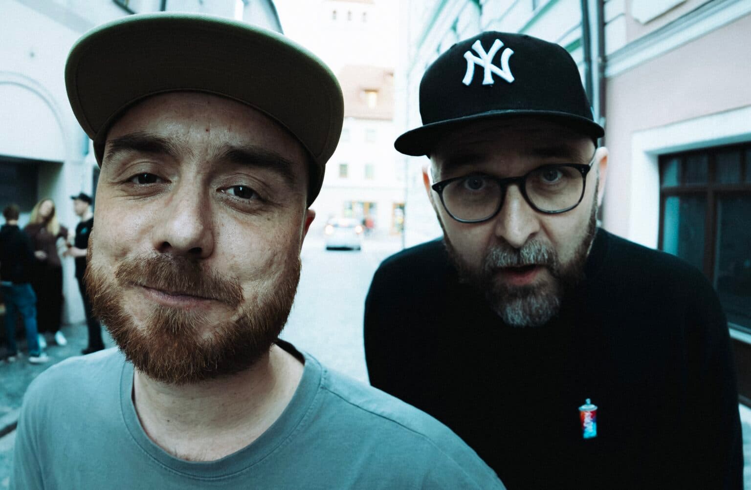 Two rap artists posing together for a promotional photo.