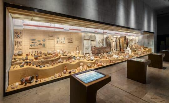Interior gallery of the Egyptian art museum with sculptures on display.