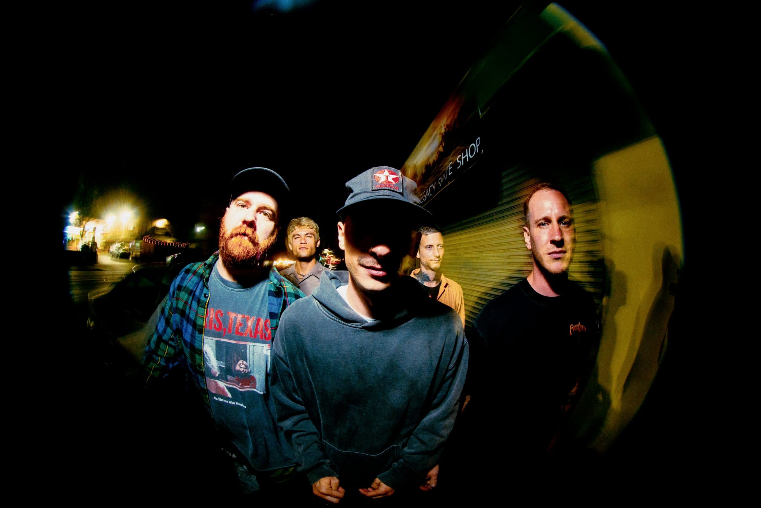 Members of the band Drug Church posed together in a press photo.