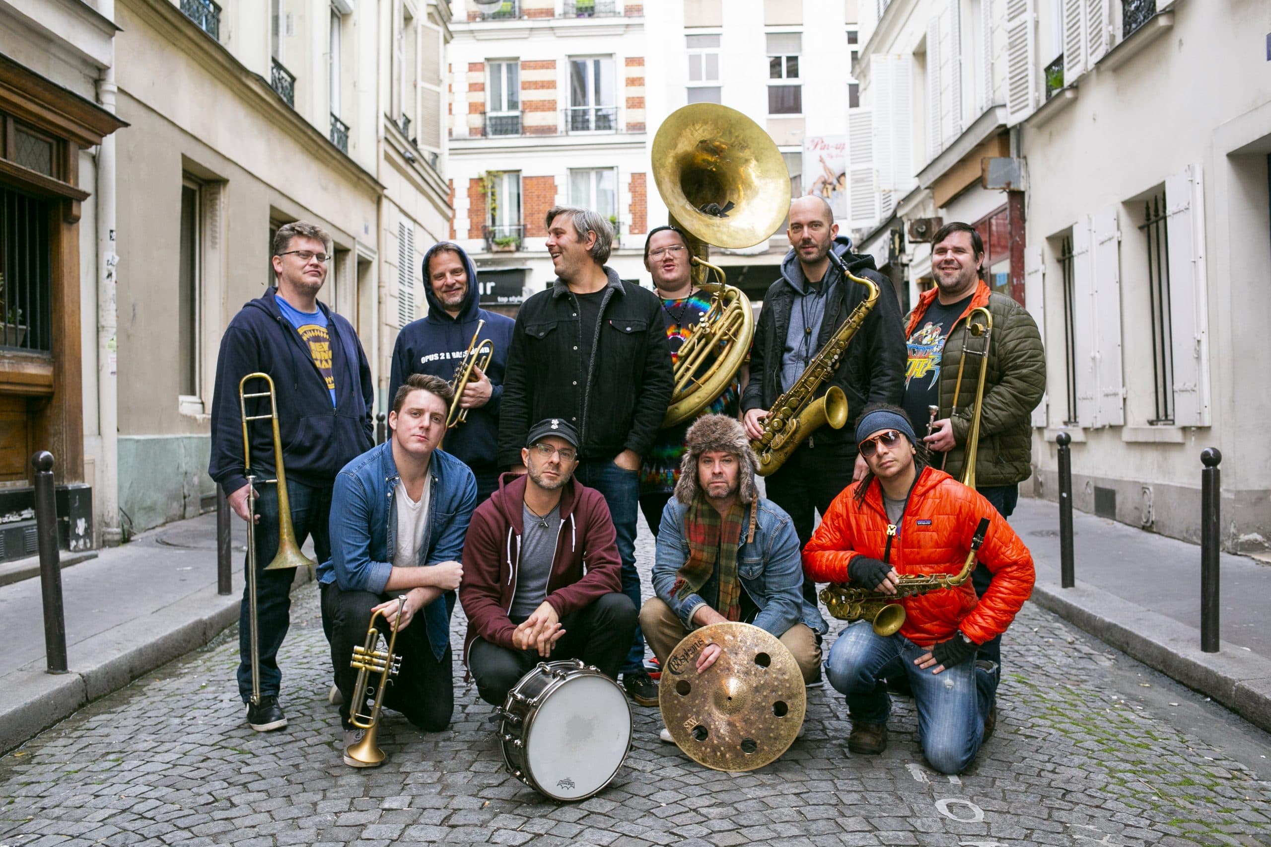 Members of the Youngblood Brass Band posed together with their brass instruments.