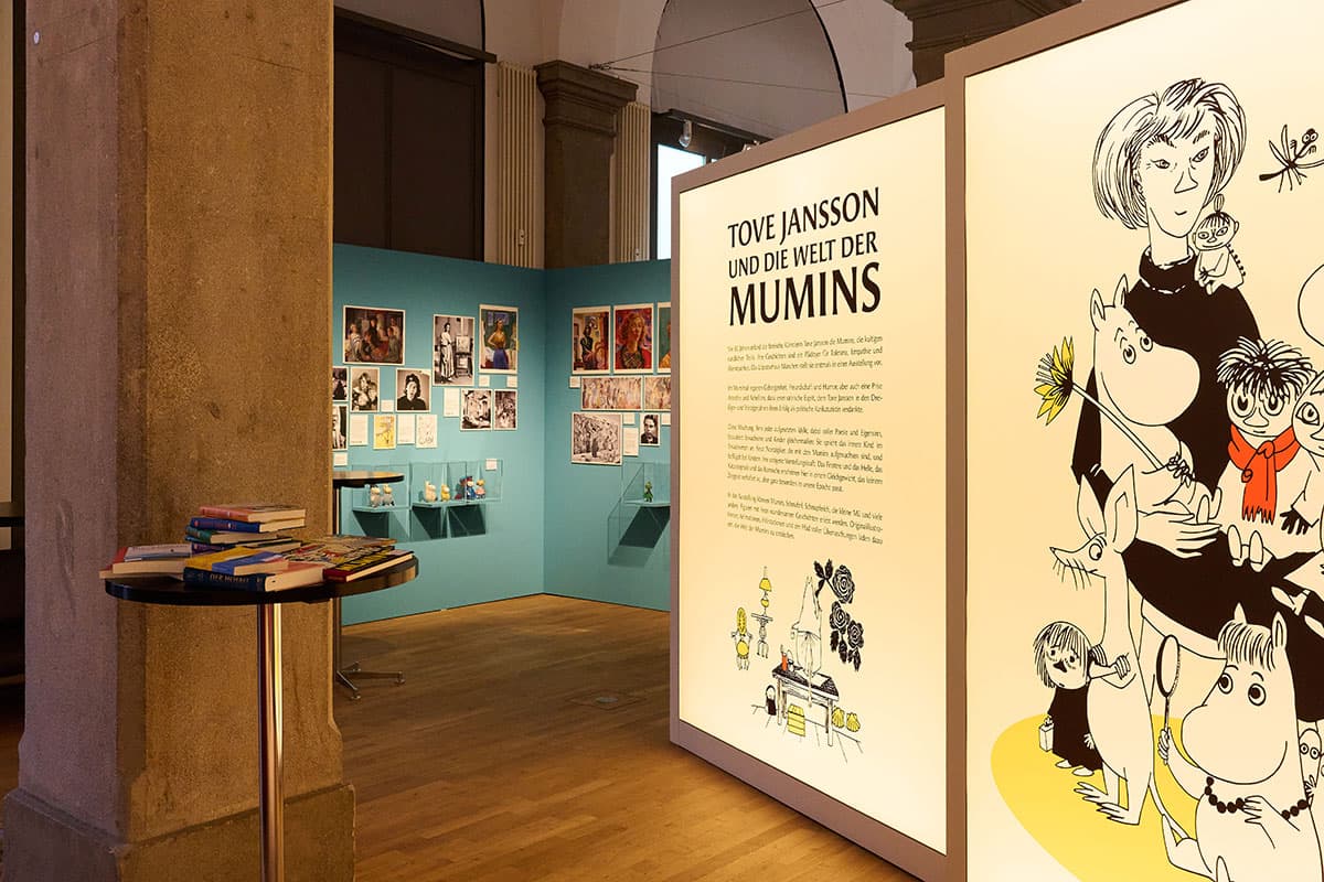 The Tove Jansson exhibition at Literaturhaus München, with Moomin illustrations across the gallery walls.