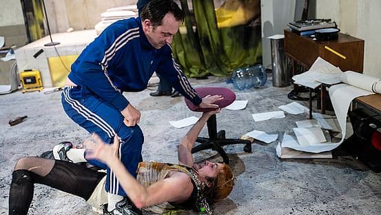 A tense ensemble scene from the Residenztheater production of Peter Weiss' Marat/Sade in the Marstall.