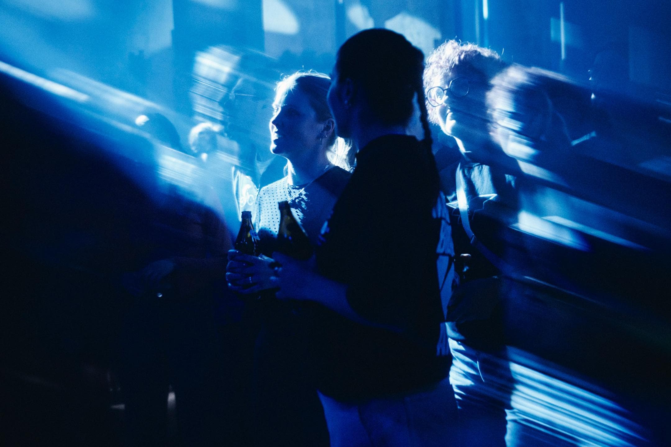 People dancing under coloured club lights in the Barbastelle.