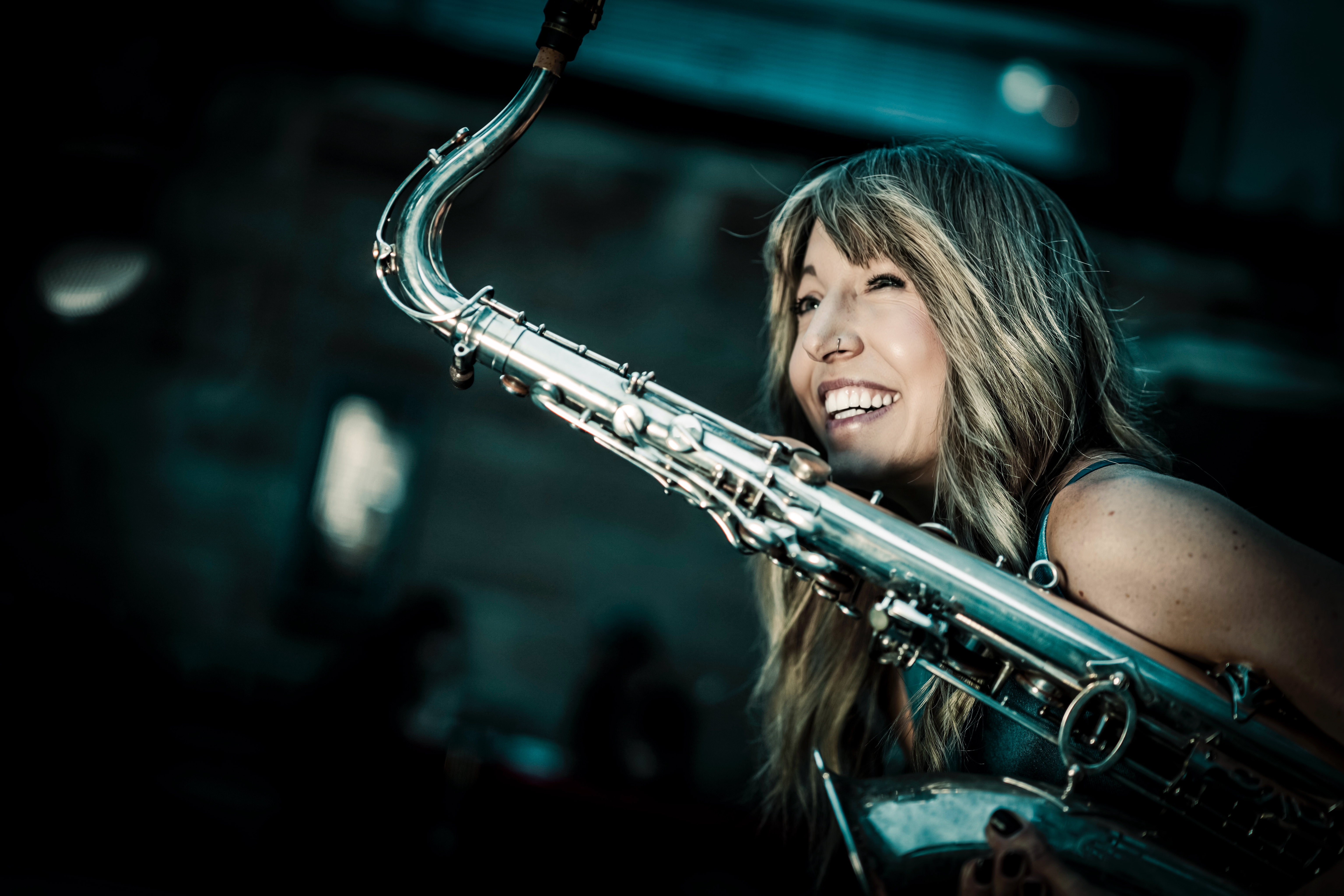 Saxophonist and singer Stephanie Lottermoser holding her saxophone in a promotional portrait.