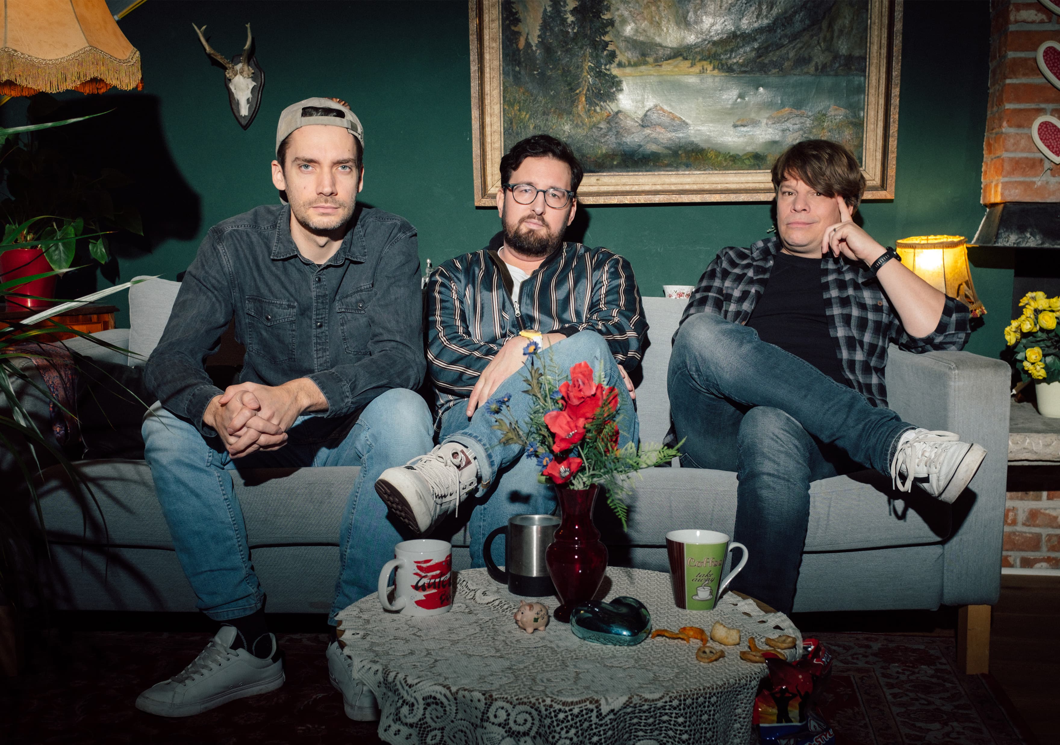 The three Erdbeerkäse podcast hosts posing together for the live reunion show.