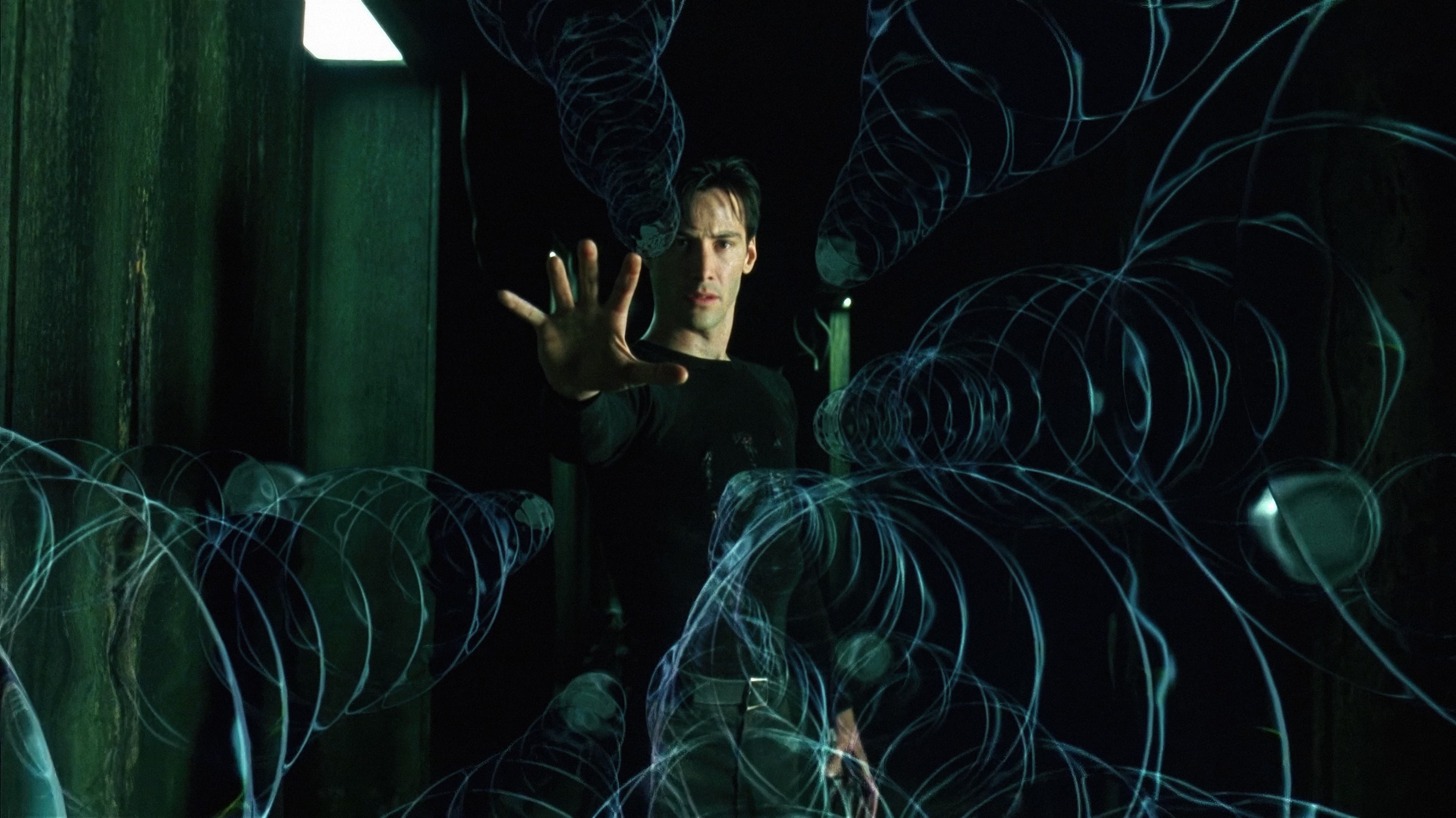 Young person in a black shirt stands in a dim green corridor, extending itshand as translucent blue spiral light trails coil around it.