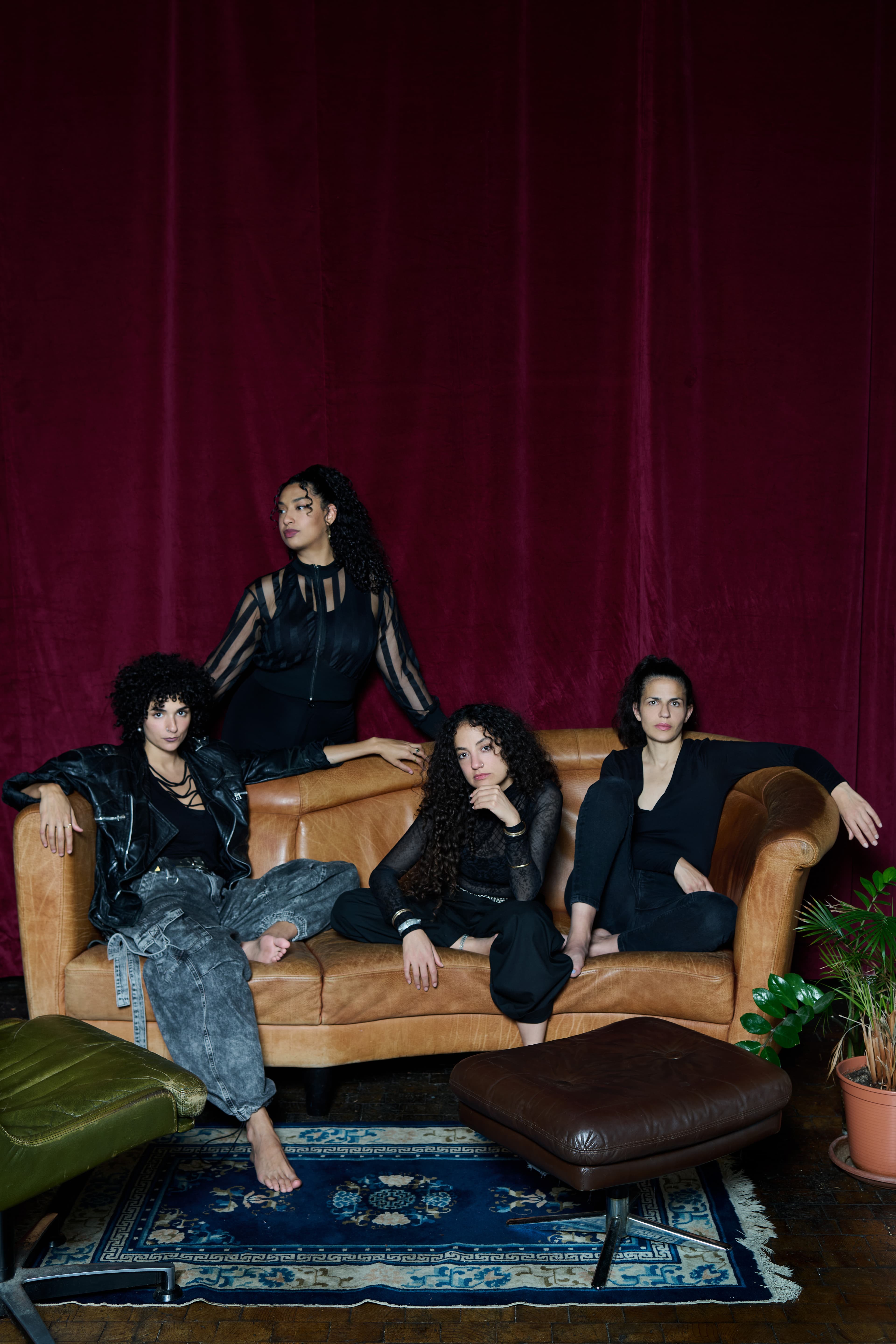 Press photo of the band Kallemi posing together for a portrait.