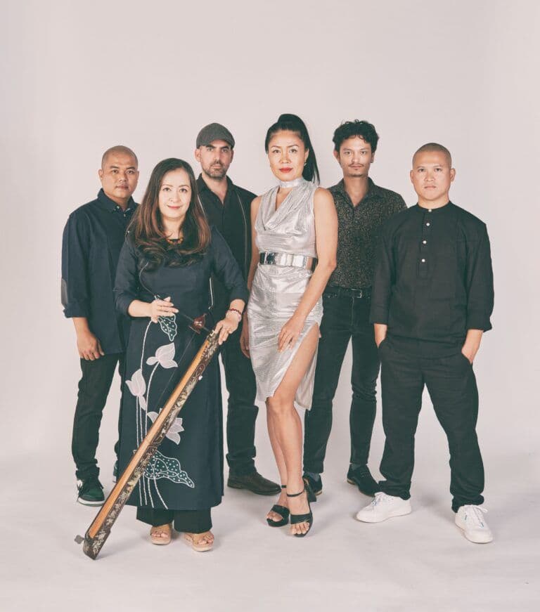 The band Saigon Soul Revival posing together, featuring guest singer Hai Phuong.