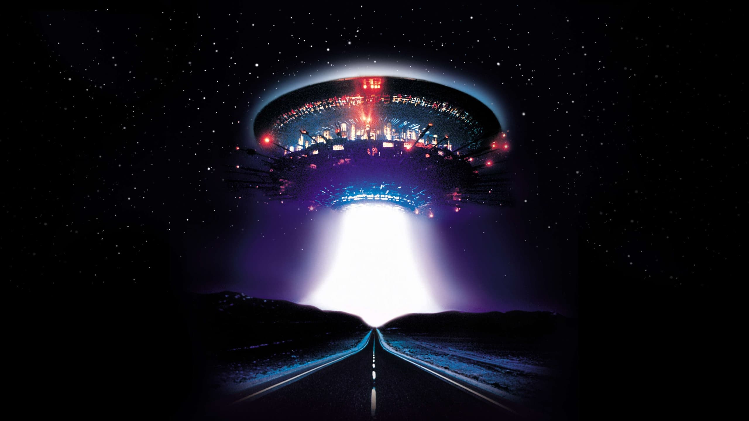 A glowing spacecraft above a dark road in Close Encounters of the Third Kind.