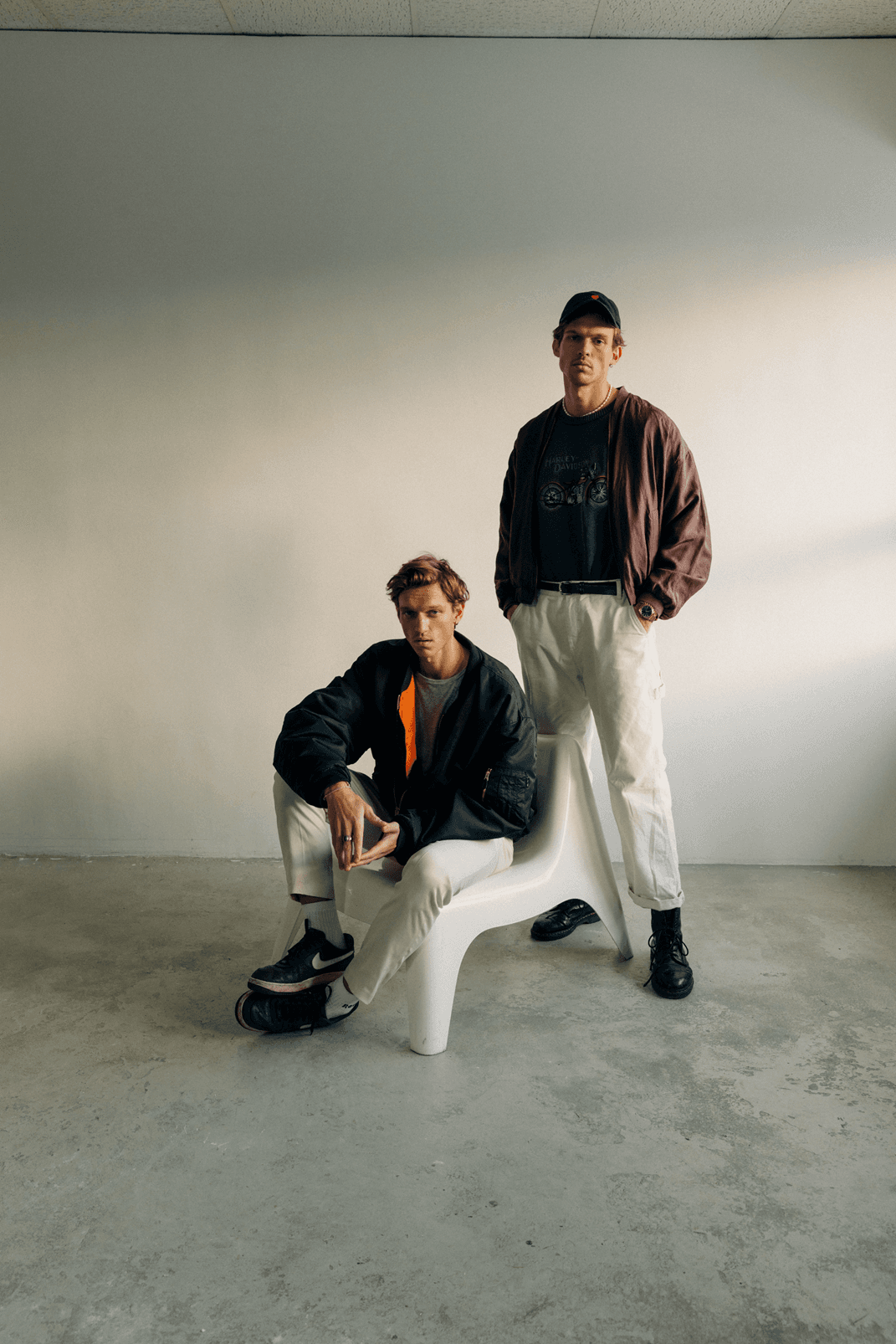Promotional photo of the electronic duo FAST BOY, the two Hain brothers, posing together.