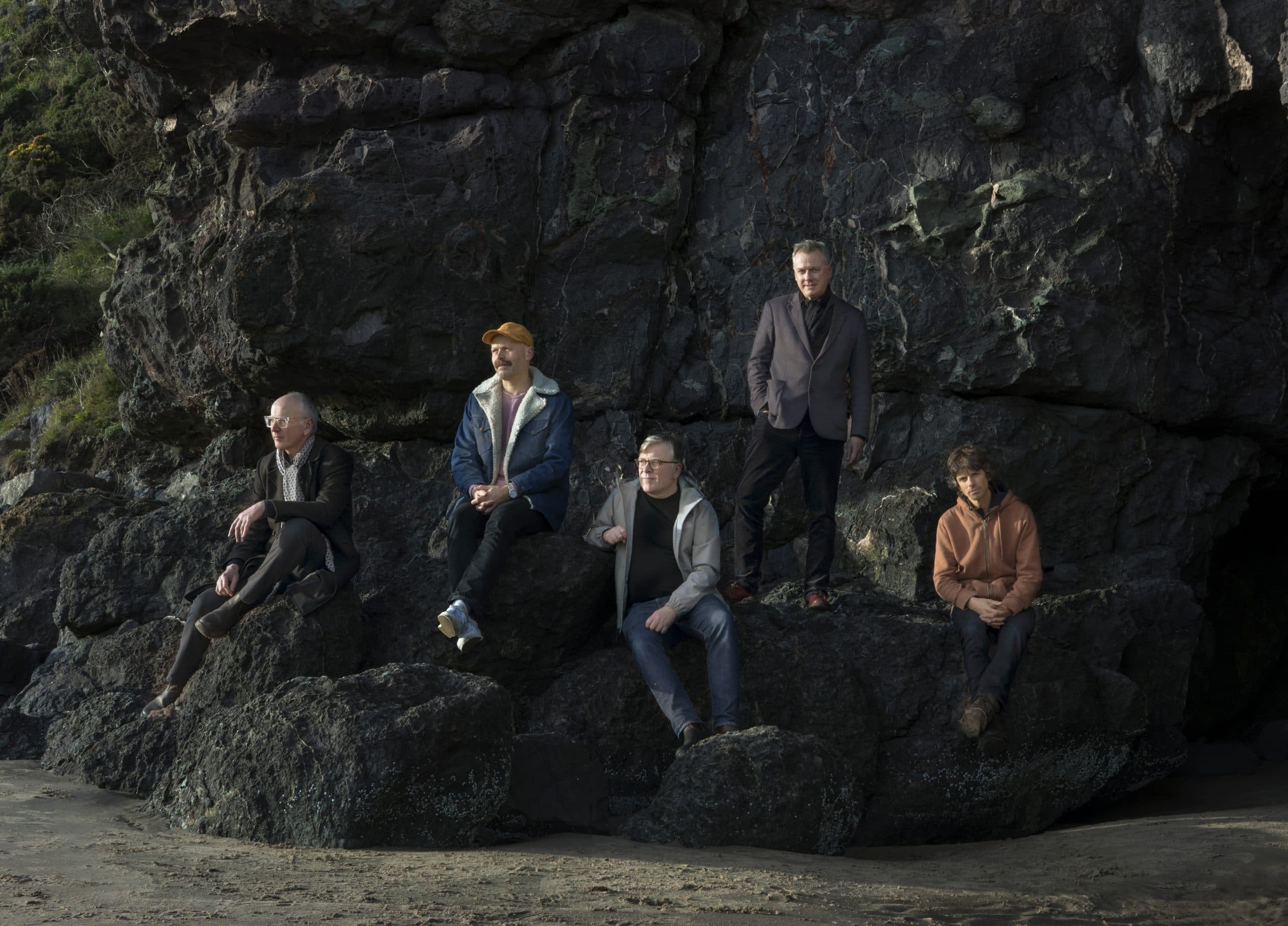 Members of Teenage Fanclub posed together for a 2026 press photograph.