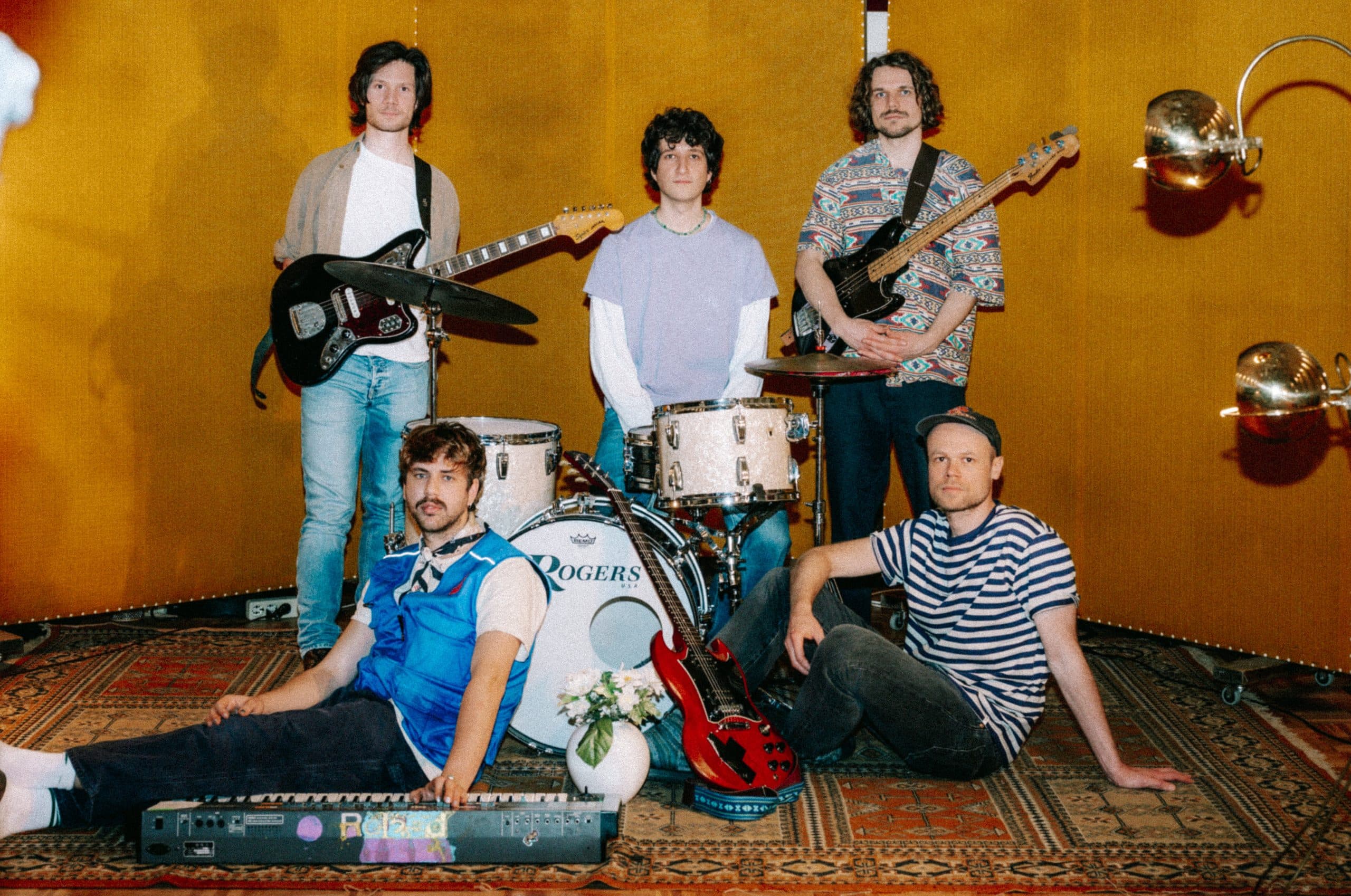 The band Some Sprouts posing together for a promotional photo.