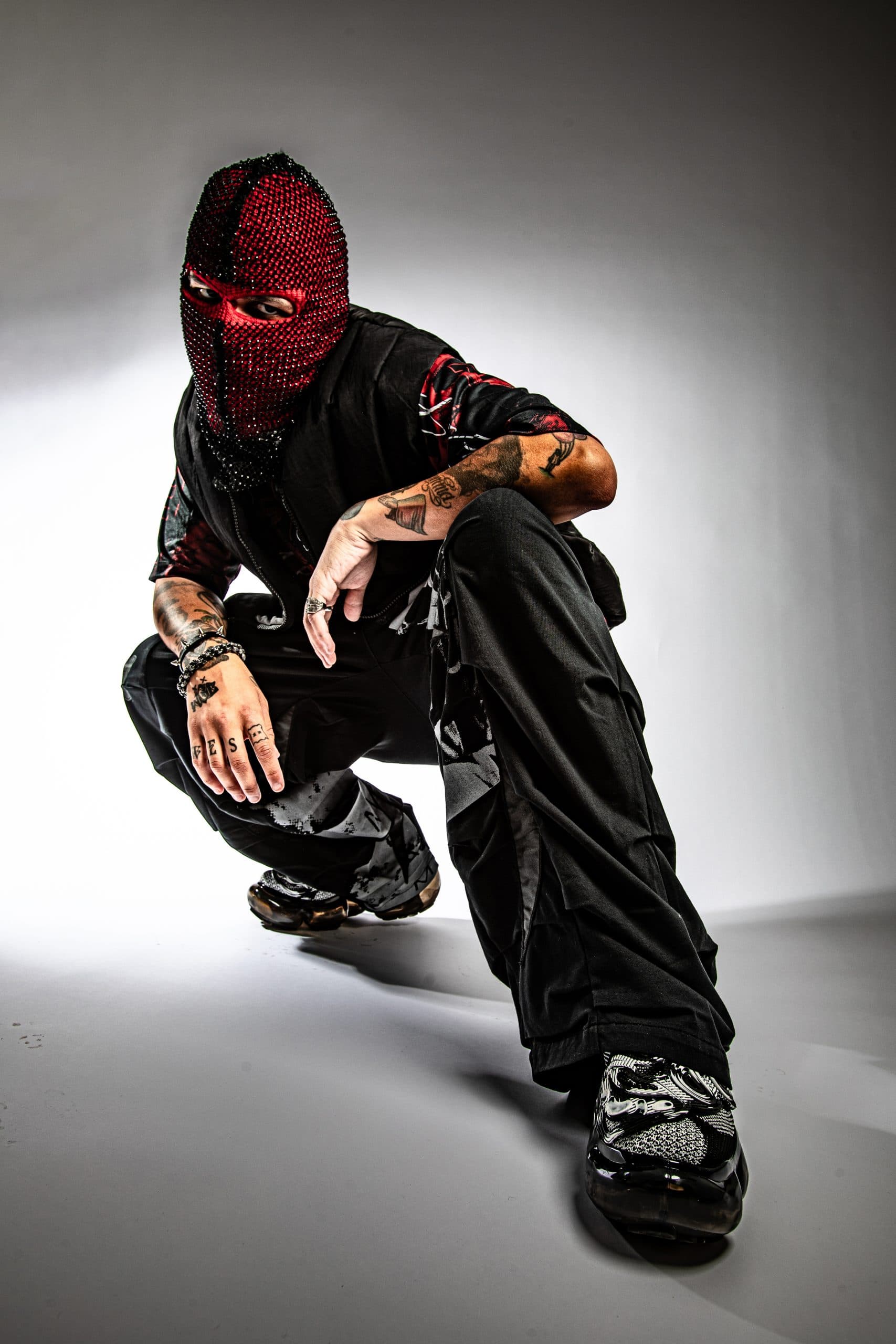 Publicity photo of WesGhost wearing a balaclava that conceals his face.