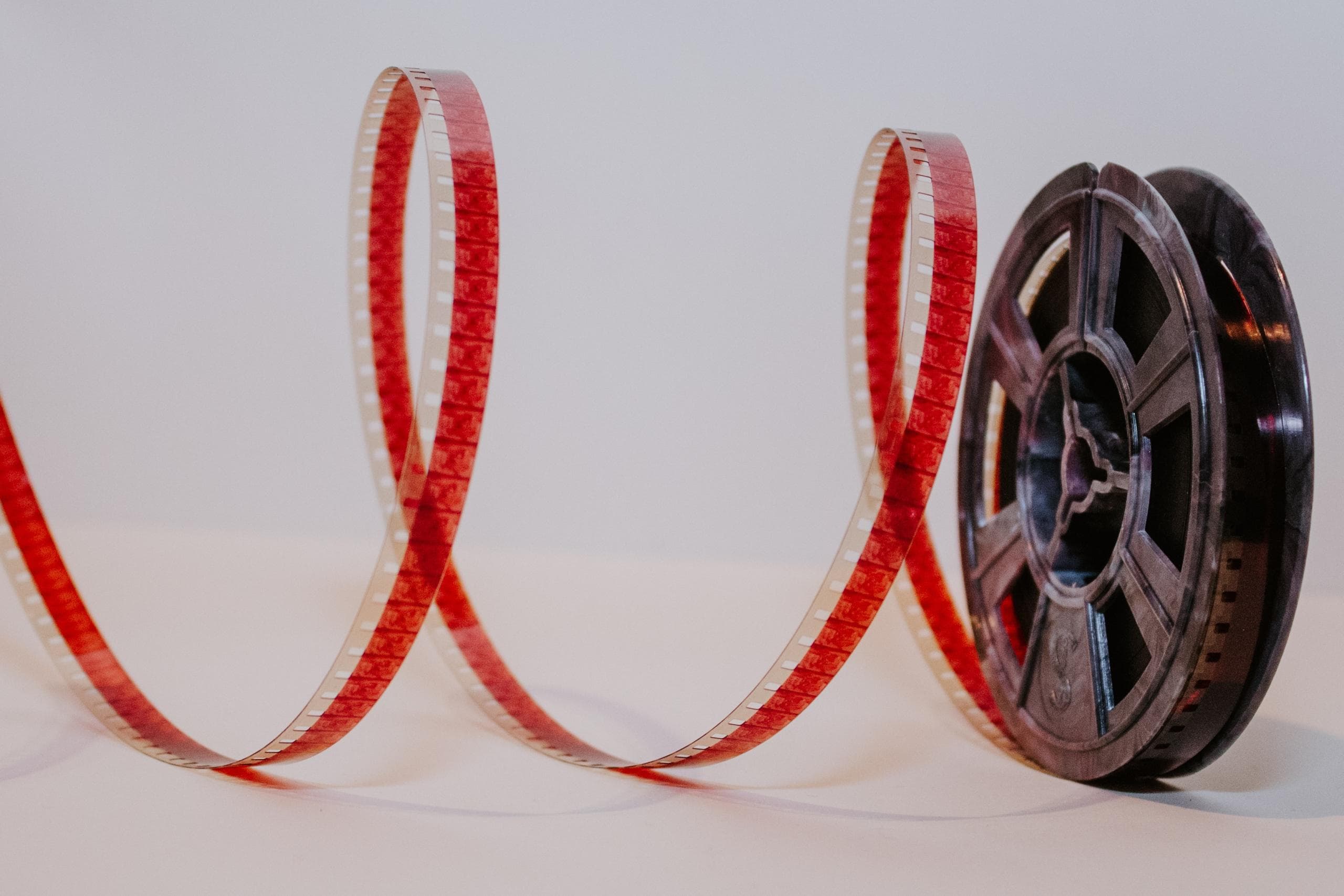 A spool of film with a strip unrolled
