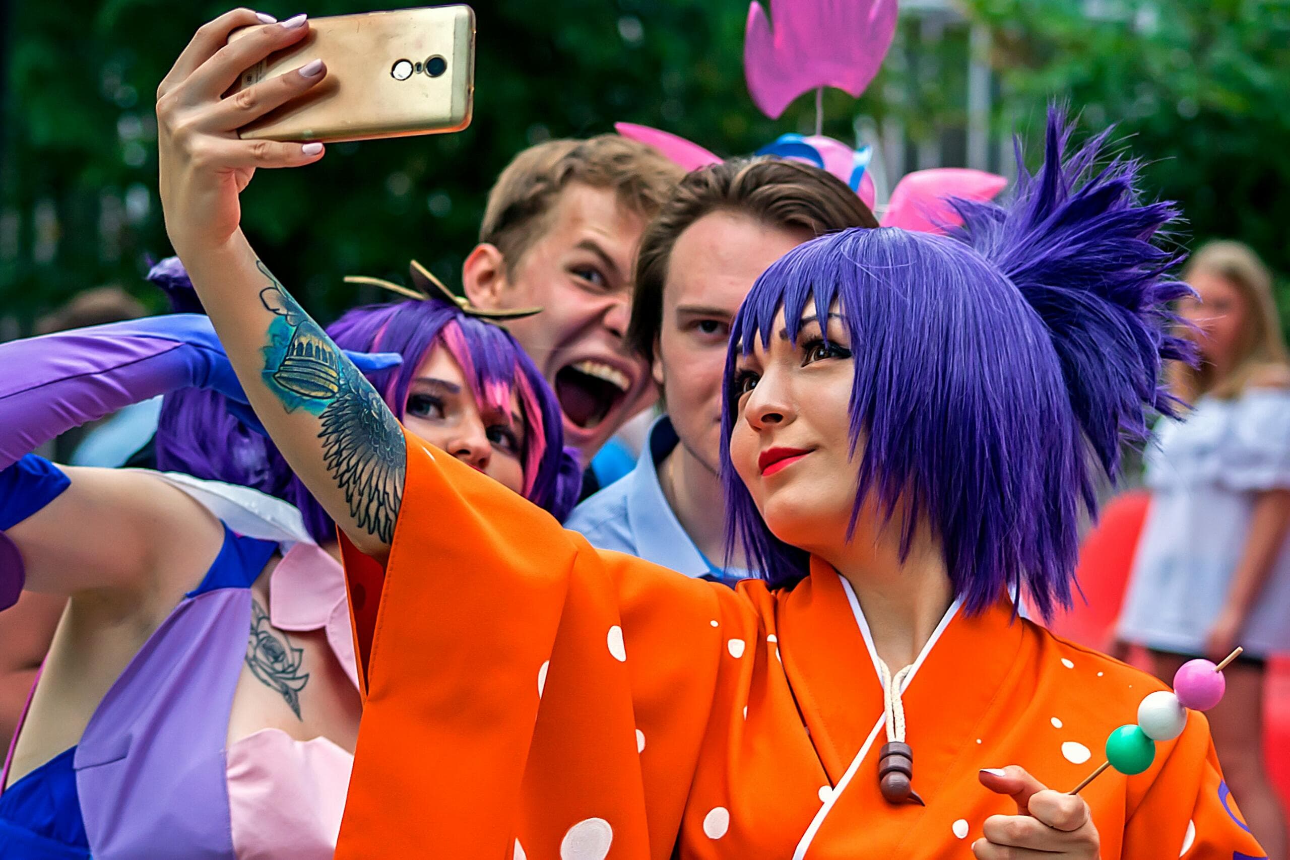 Several cosplayers taking a selfie together