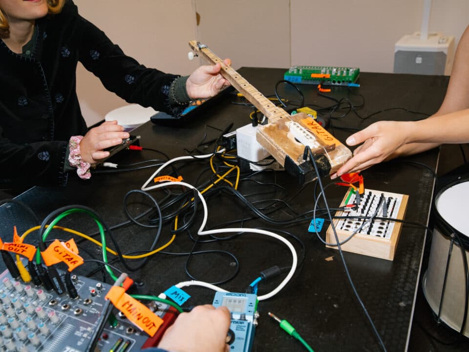 Participants connect homemade instruments, mixers and effects during an Open Atelier sound session.