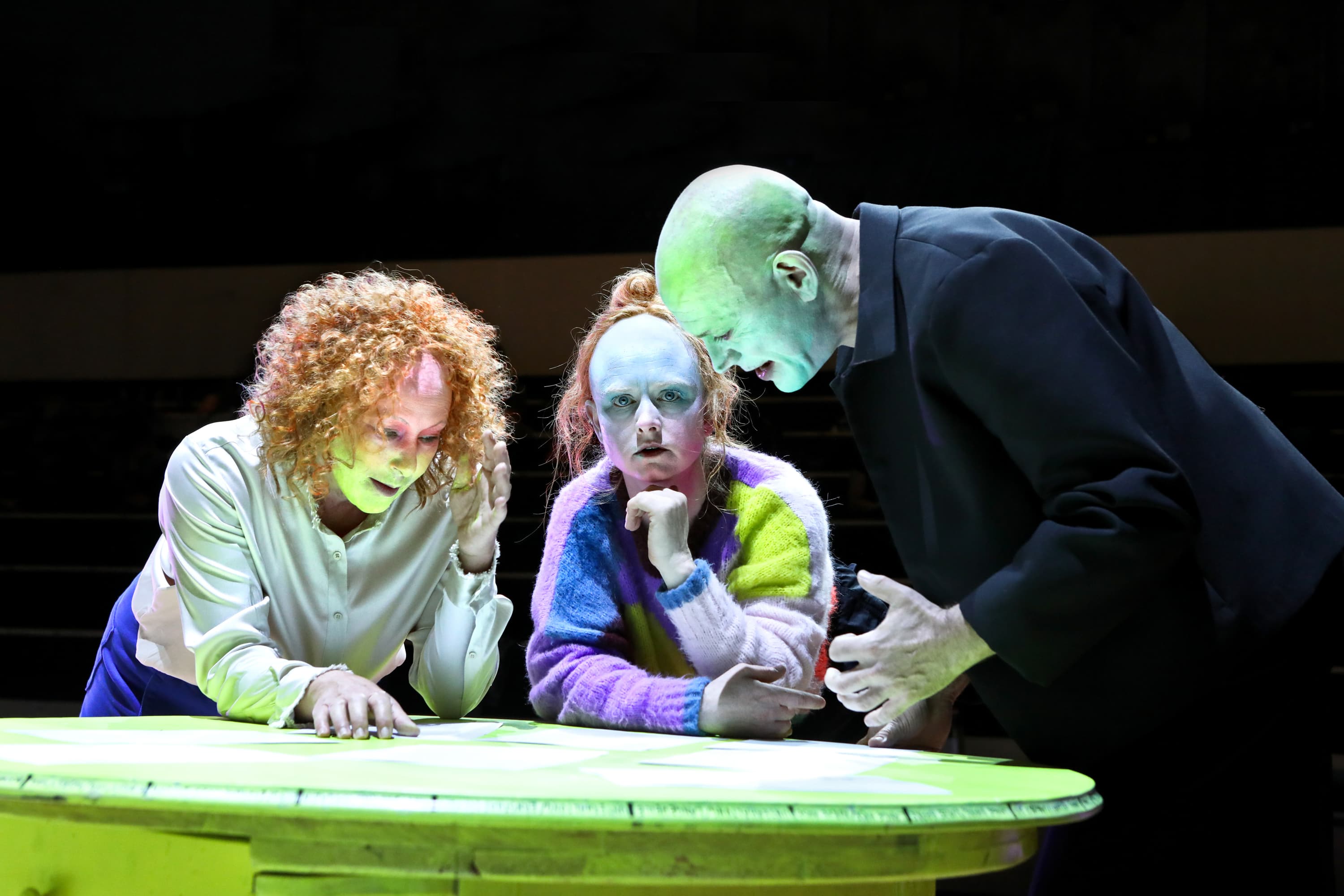 Three performers on the open Marstall stage in Nele Stuhler's production.